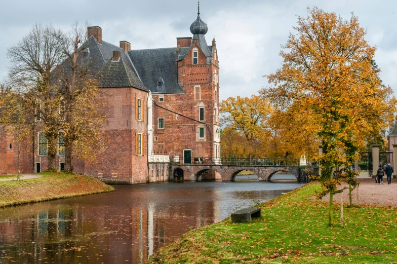 a castle with a bridge and a small river