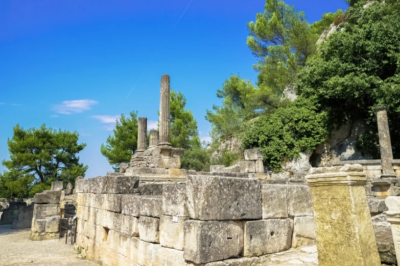 some ancient ruins sitting on the side of a road