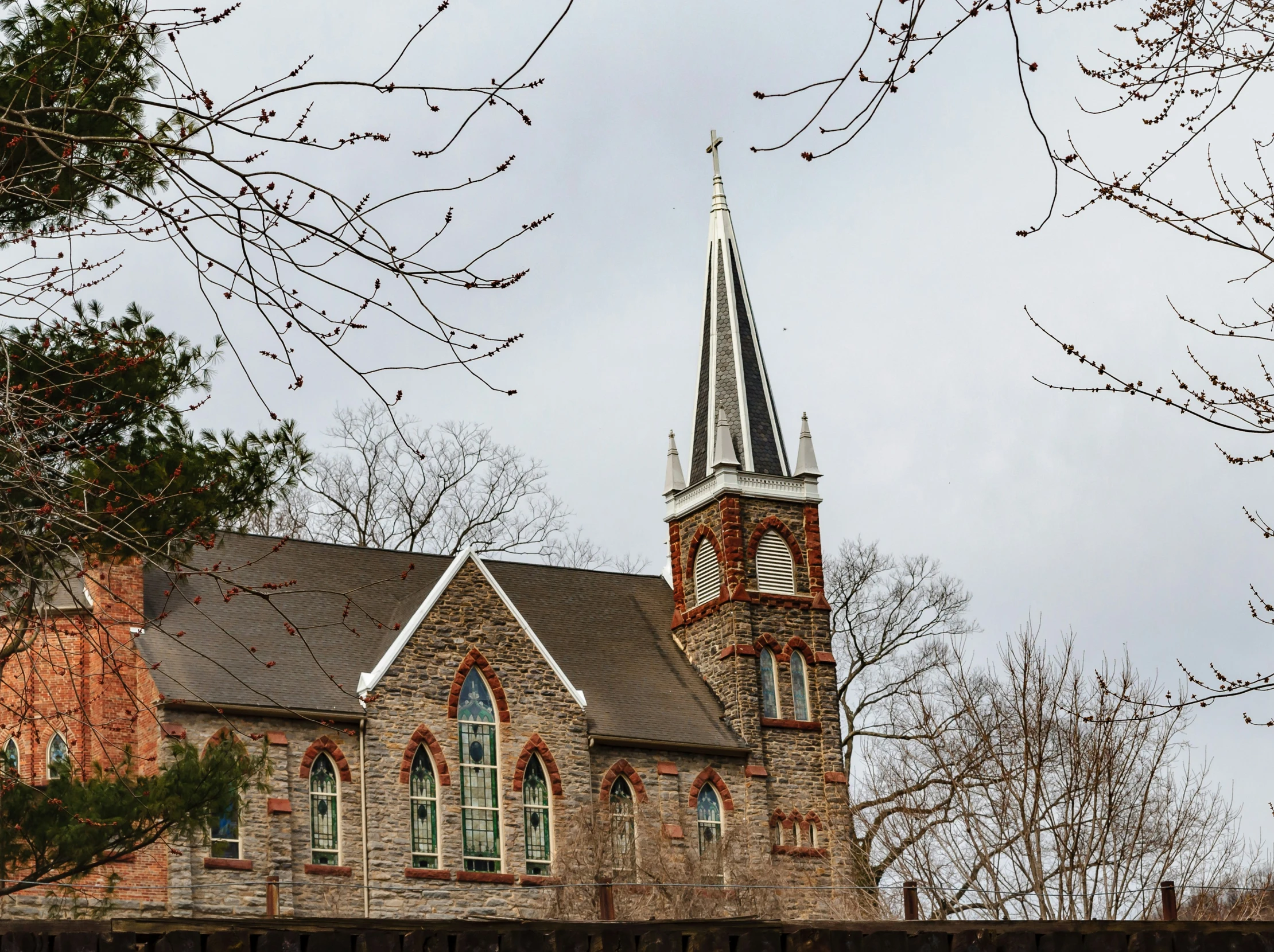 a large brick church with a clock tower