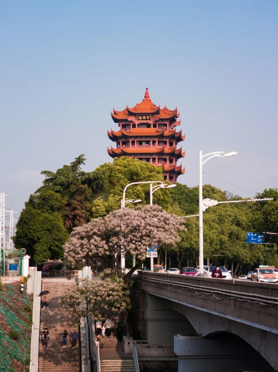 the red building is located next to a bridge