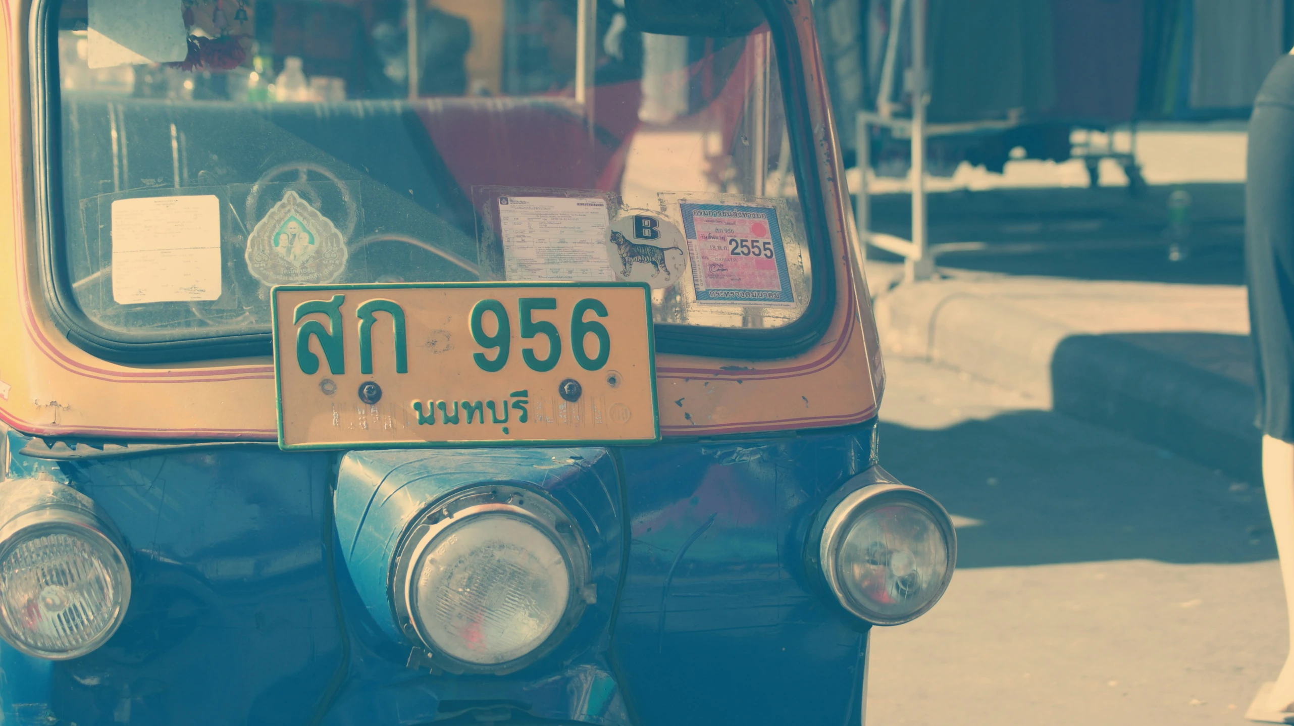 the back of a vehicle that is parked on a street