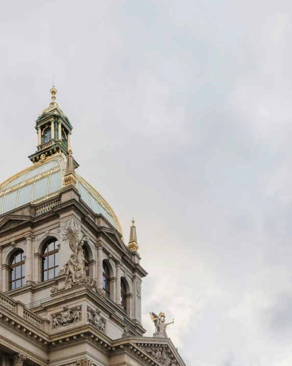 there are many spires on this building with a clock