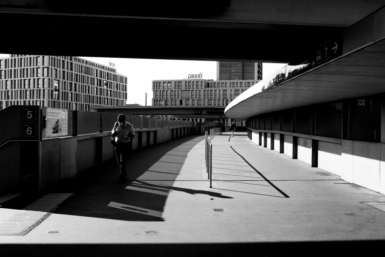 a man is riding his bike on the walkway