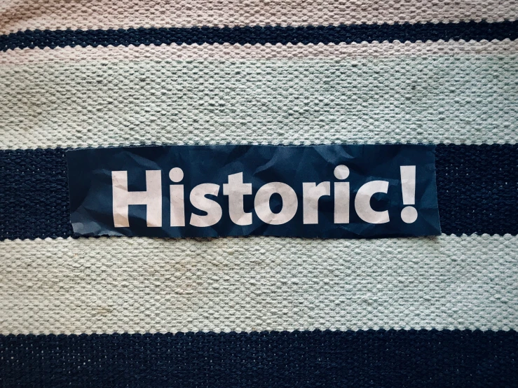 a blue and white striped shirt that says historic