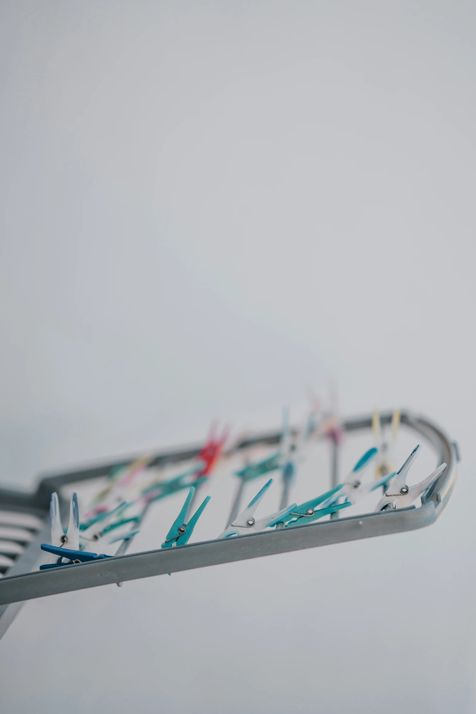 toothbrushes sit on the top of a metal rack