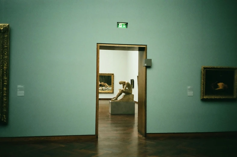 a painting is seen through an open door