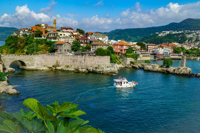 an island with houses that has boats in it