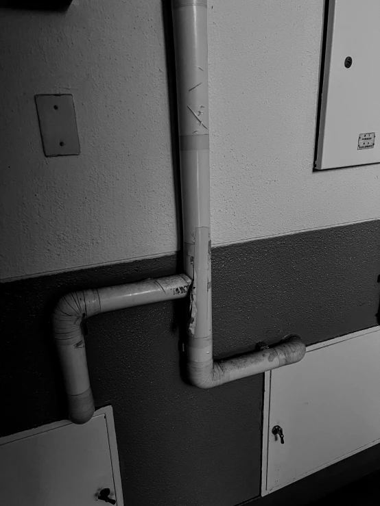 a black and white image of a line of pipes