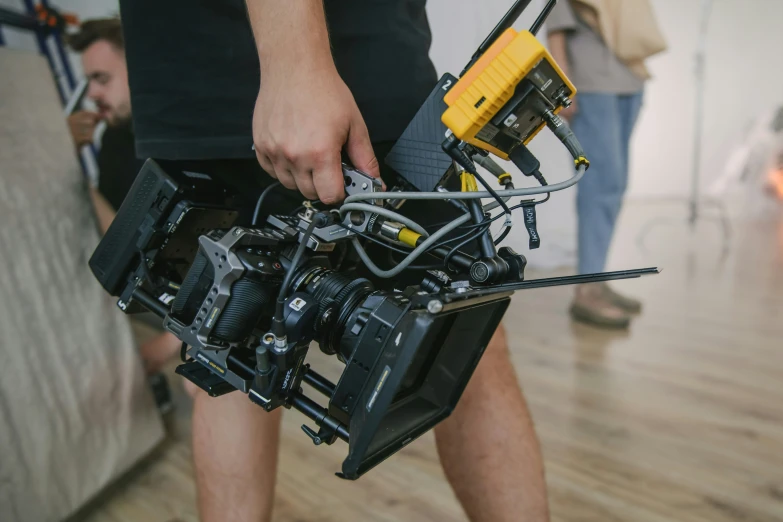 the side view of a man holding a camera