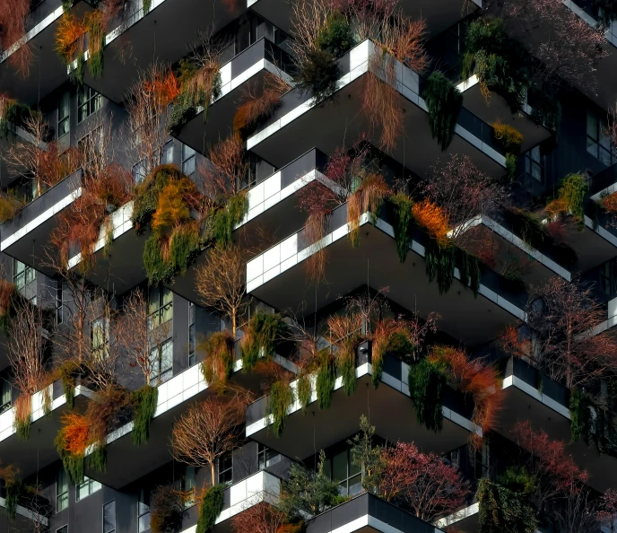 the tall building has lots of plants and lights on it