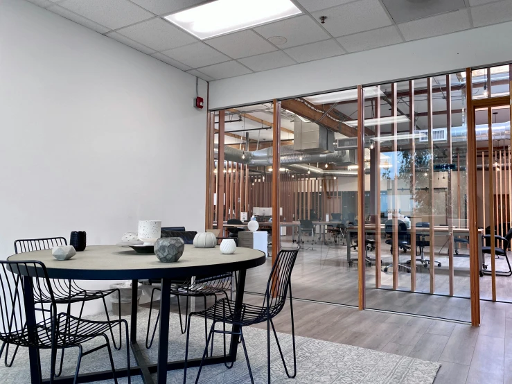 a large open room with a black round table