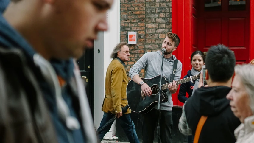 some people are walking around with guitars in hand