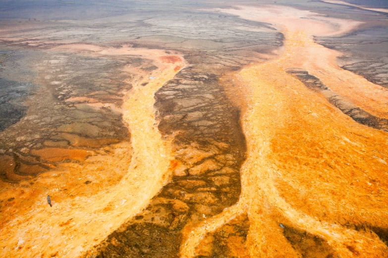 an airplane is flying over a large, winding river