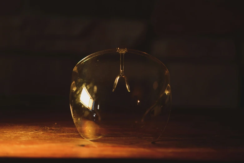 a glass globe sitting on a wooden table