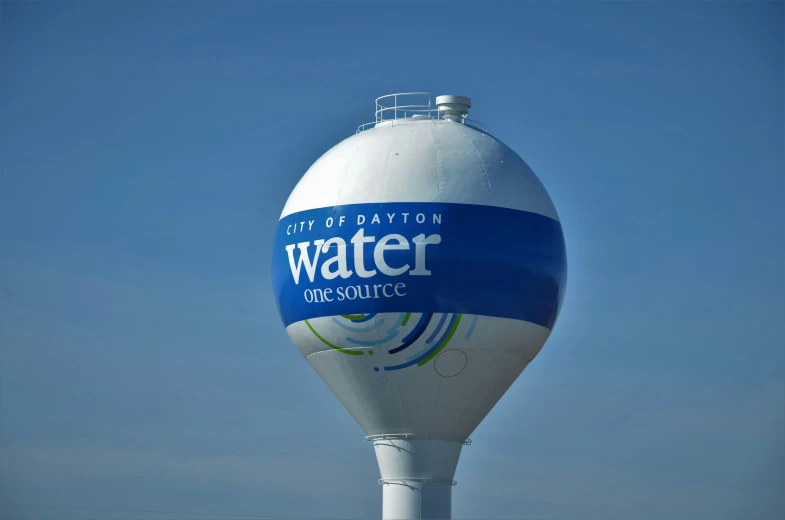 a water tower is shown against the blue sky