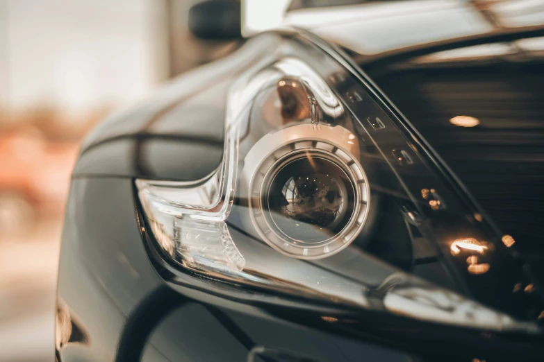 the reflection of the camera on the side of a car