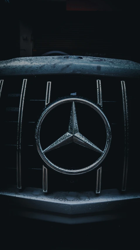 mercedes emblem on the grille of a car