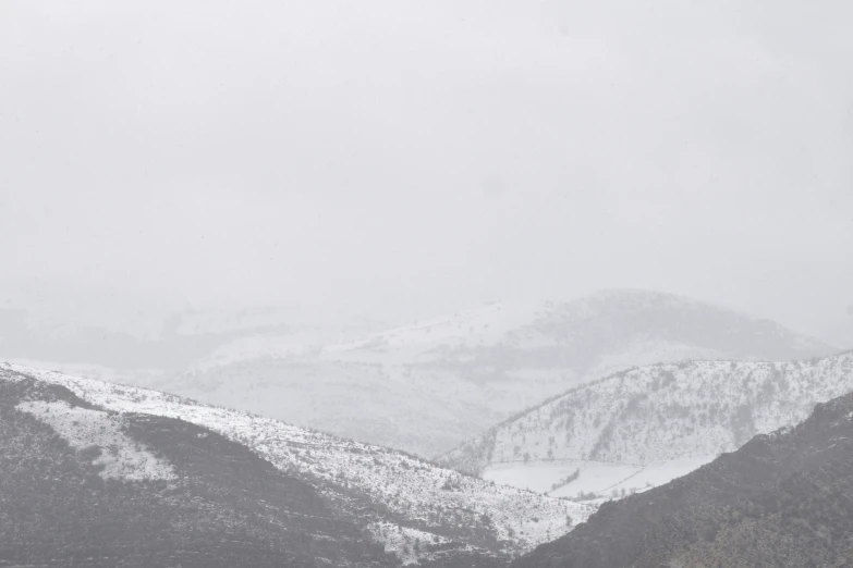 a person riding skis down a snow covered slope