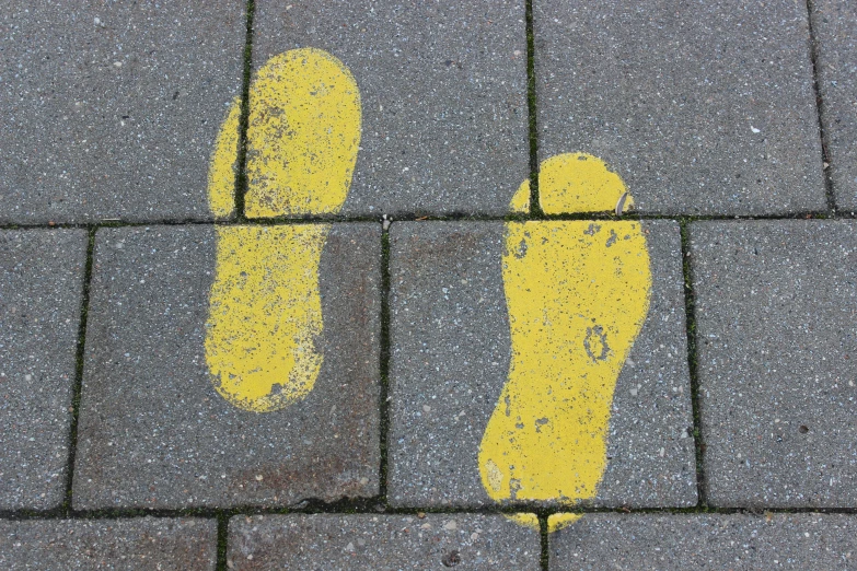 there is yellow feet mark on the road