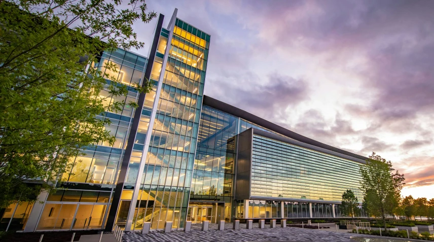 glass building that has an open roof in front