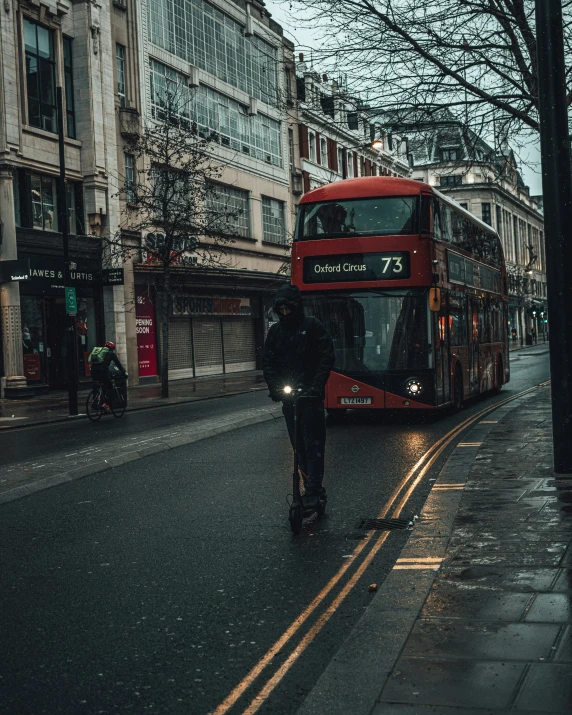 a double decker bus is driving down the street