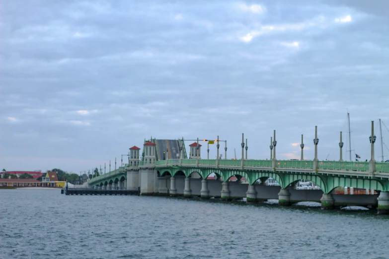 a bridge in the middle of a large body of water