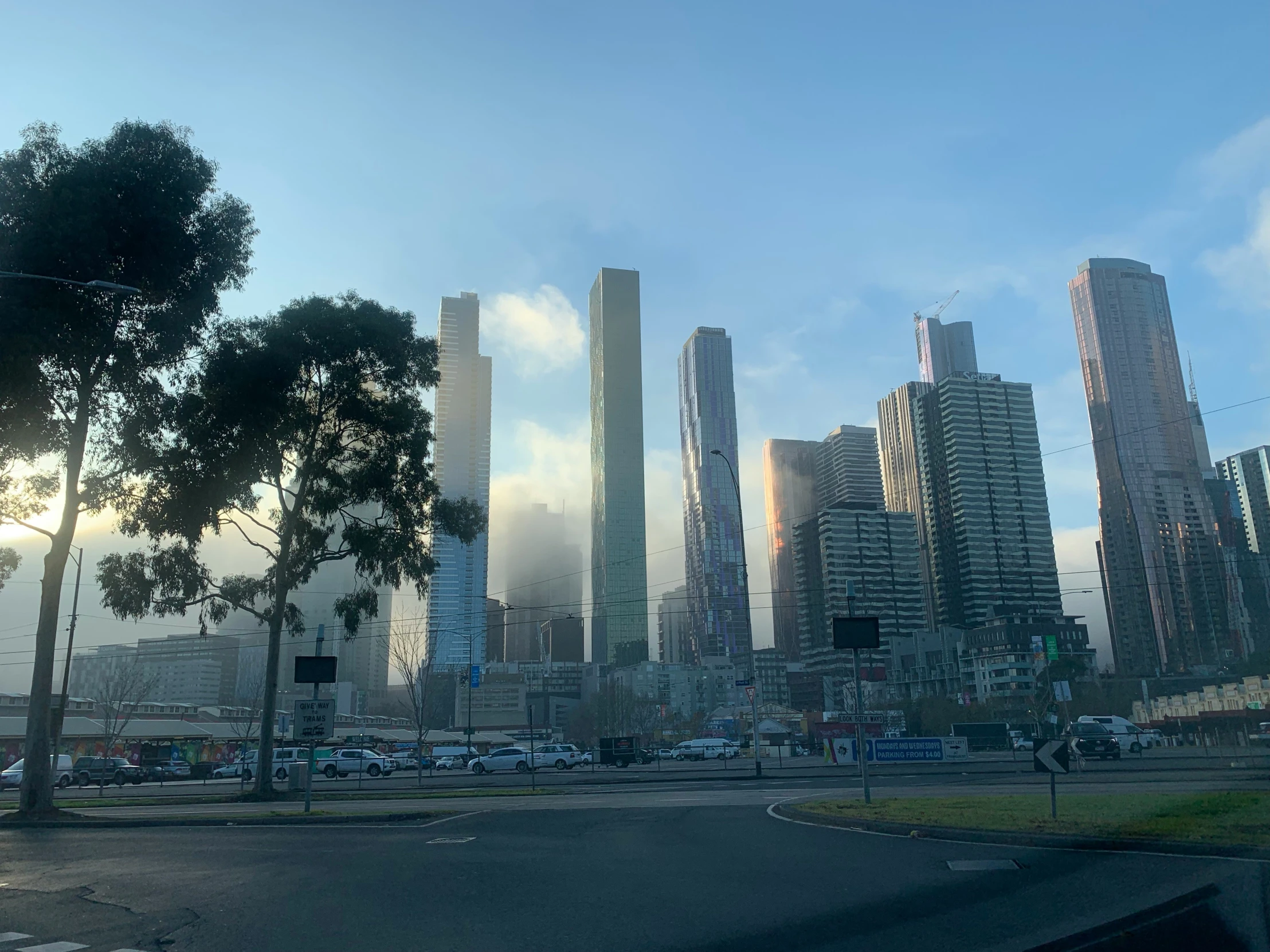 a street is near a city full of tall buildings