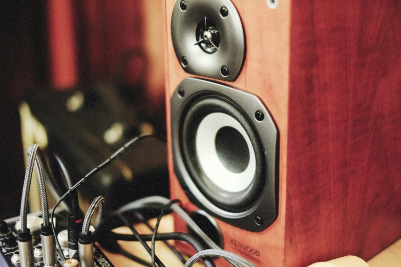 two speakers are sitting on top of the table