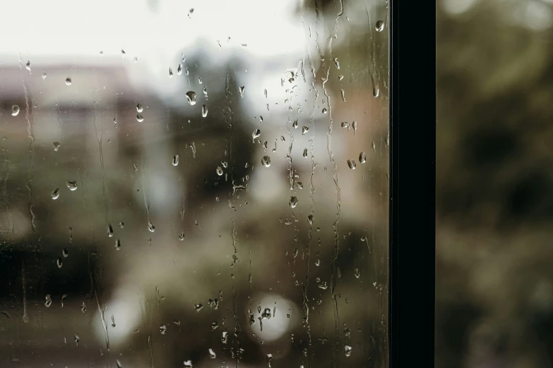 a window with water droplets on the outside