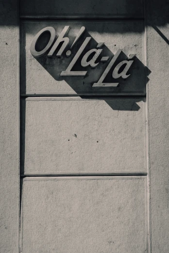 a olerfa sign mounted on the side of a building