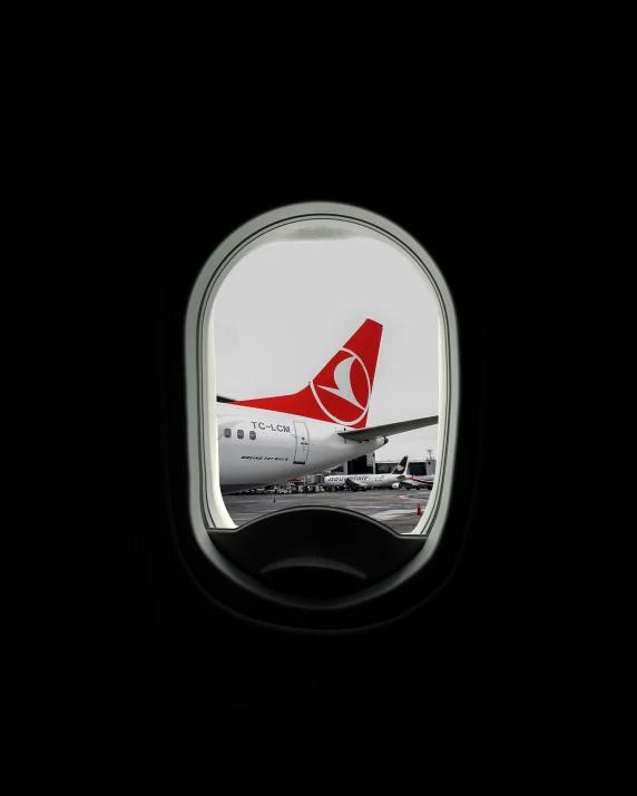 an airplane's tail end seen through the windows