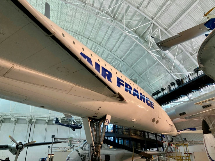 an airplane is inside of a hangar on display