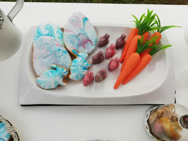 a plate that has food that includes carrots and other things