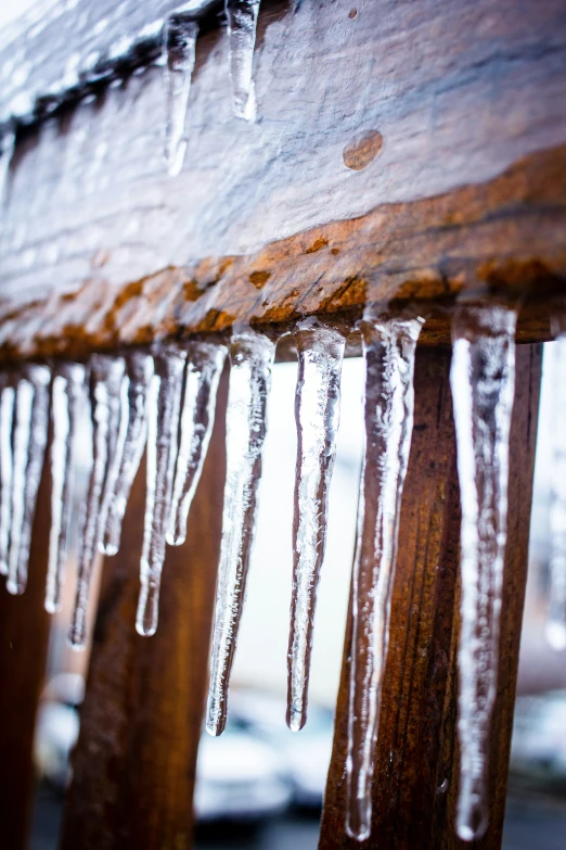 a view of some frozen up ice on top of a bench