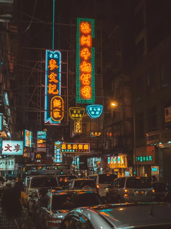 a city street full of traffic at night