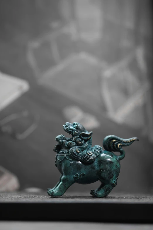 a small figurine with a dragon on it