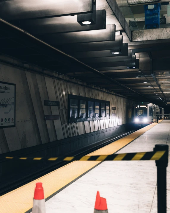 a train is stopped at an underground station