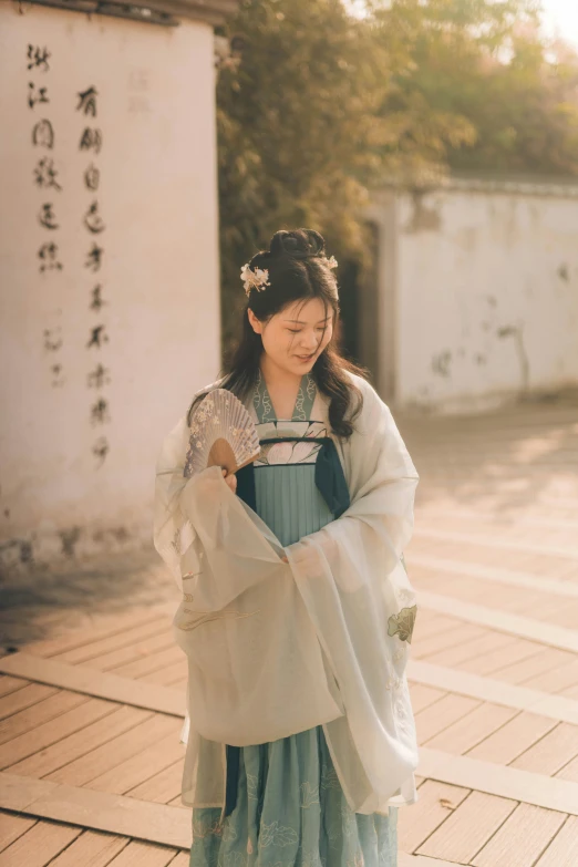 a woman in a geisha costume posing for a picture