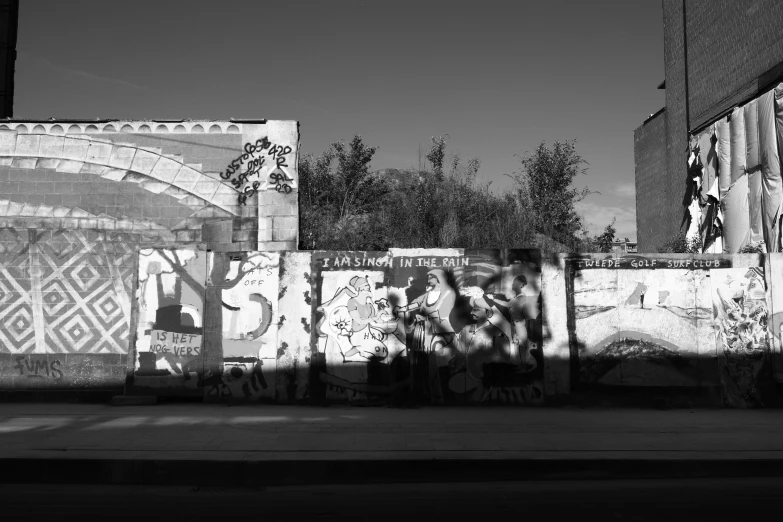 the wall has been covered with graffiti and is shown in black and white