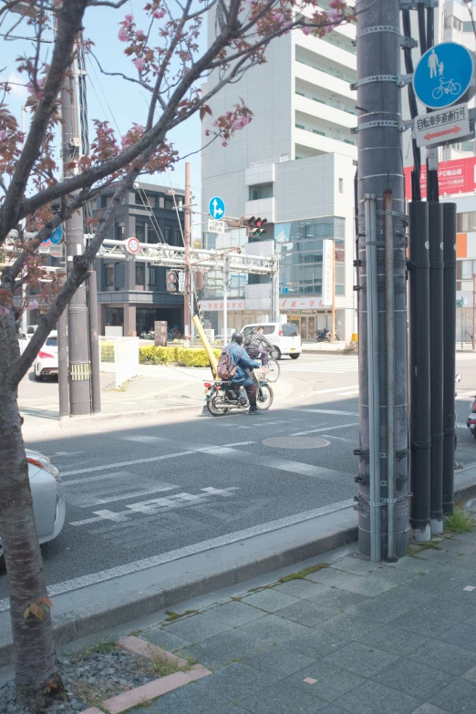 motorcycle parked in front of a large city building