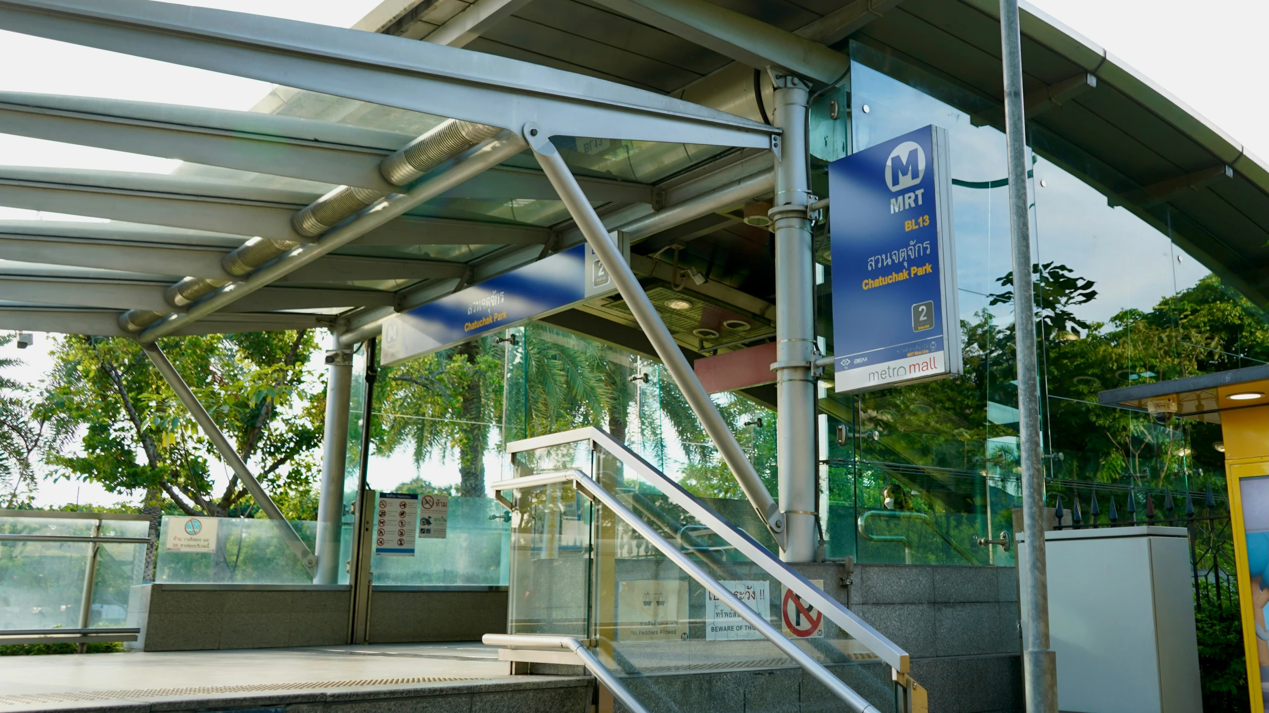 the stair railings have been lowered at the entrance to a bus stop