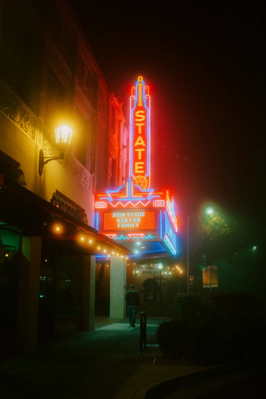 the building is illuminated with lights that are red and blue