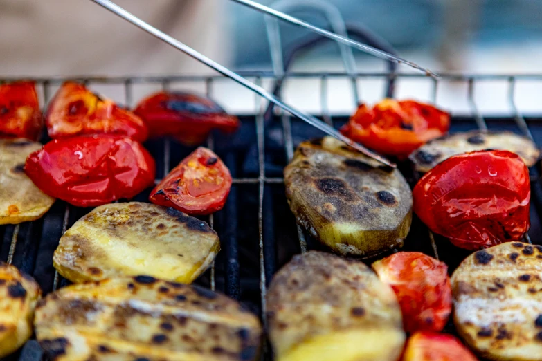 roasted tomatoes and zucchini being cooked on an oven