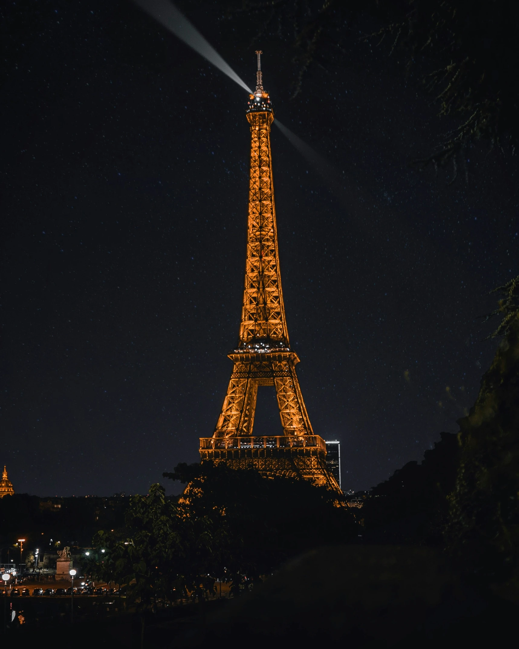 the illuminated eiffel tower against a night sky