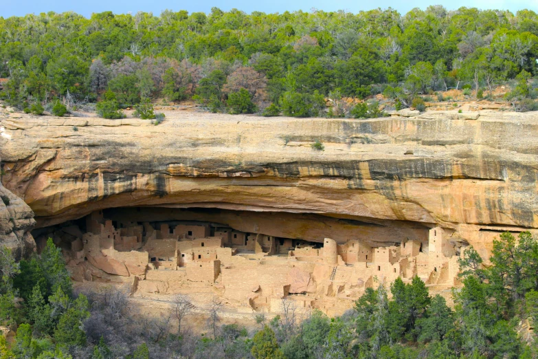 the cliff is carved into a huge cliff