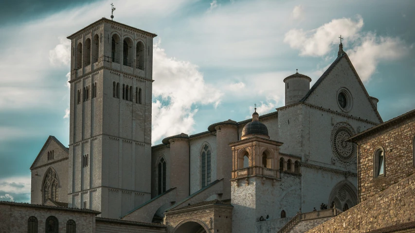 an old building that has two towers next to each other