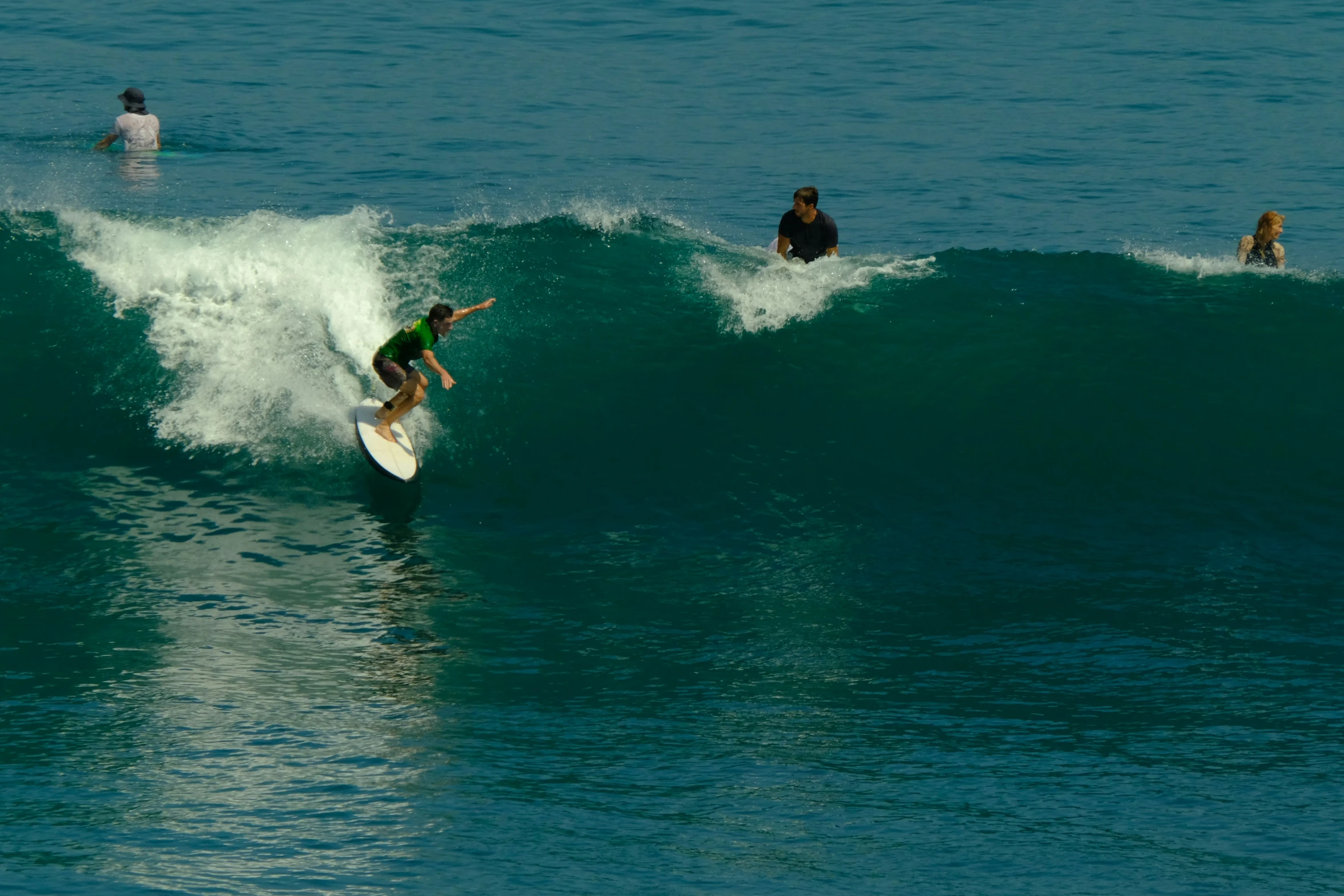 some people are in the ocean on surf boards