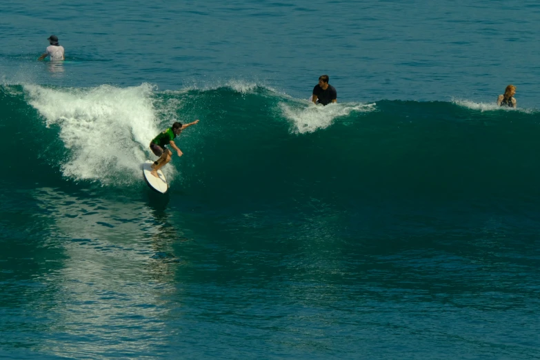 some people are in the ocean on surf boards