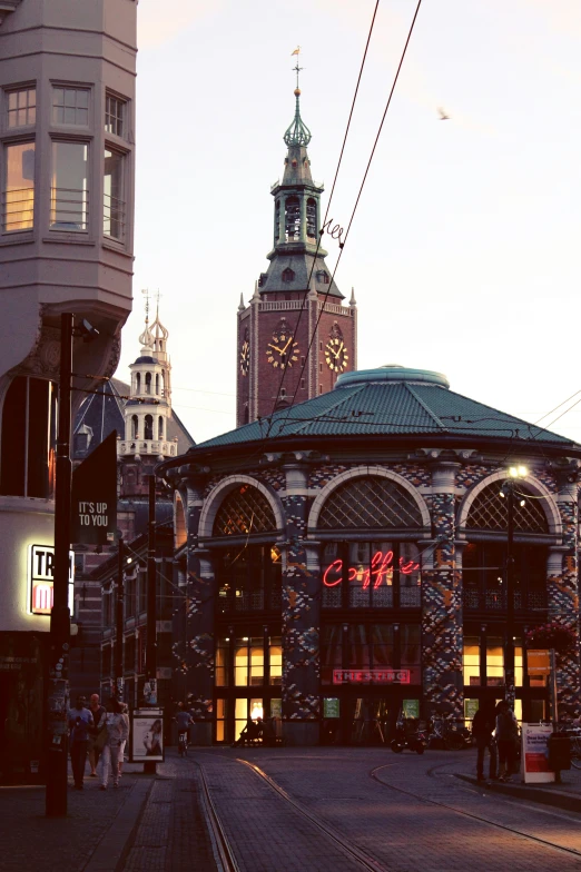 a city street has a building with a clock on it