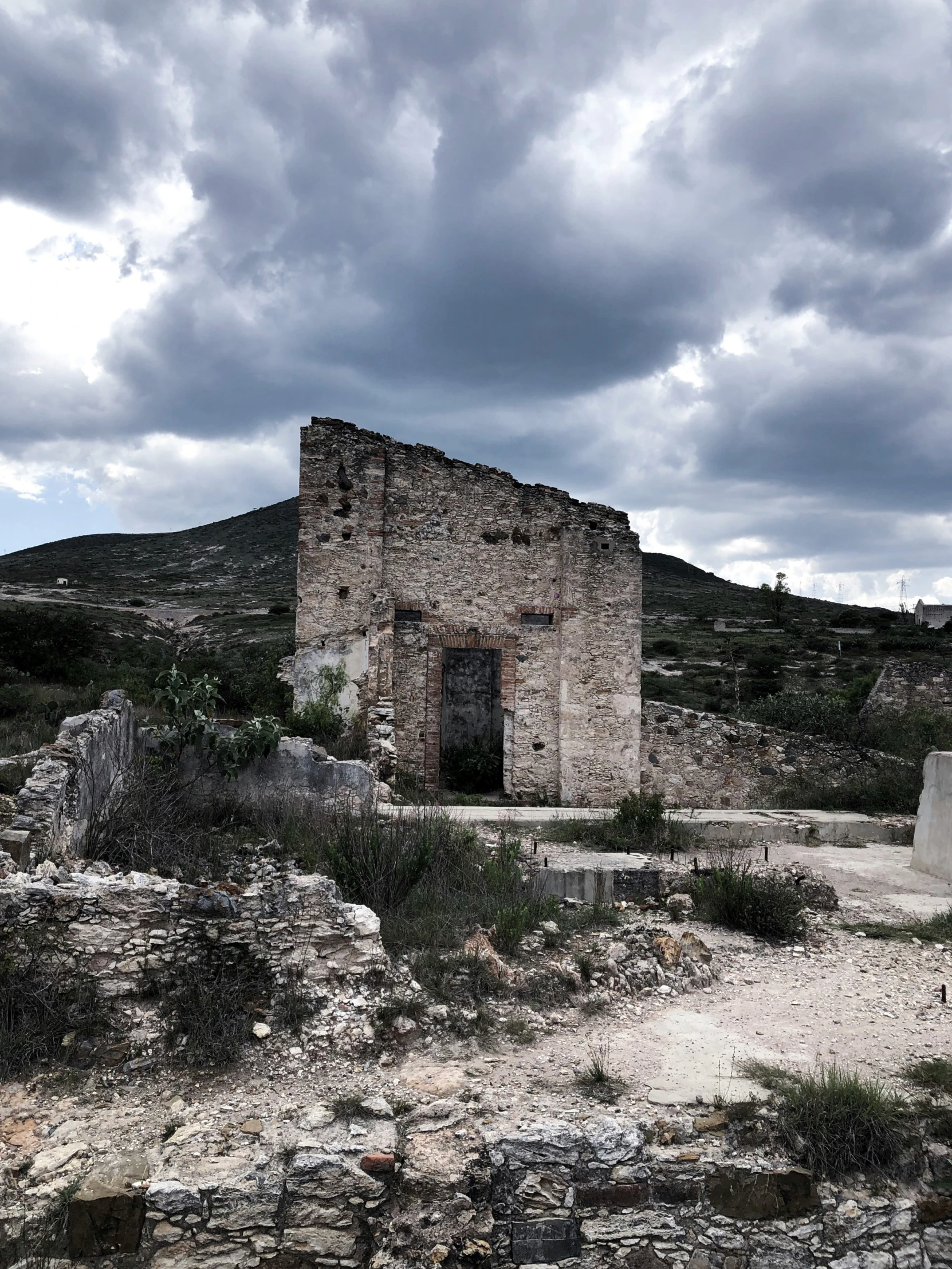 an old ruins of some sort near a hill